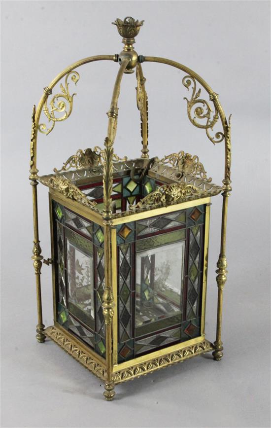 A late Victorian Aesthetic period gilt brass and stained glass hall lantern, height 35in.